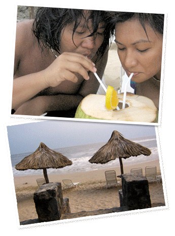 Gerry and Karina drink from a coconut